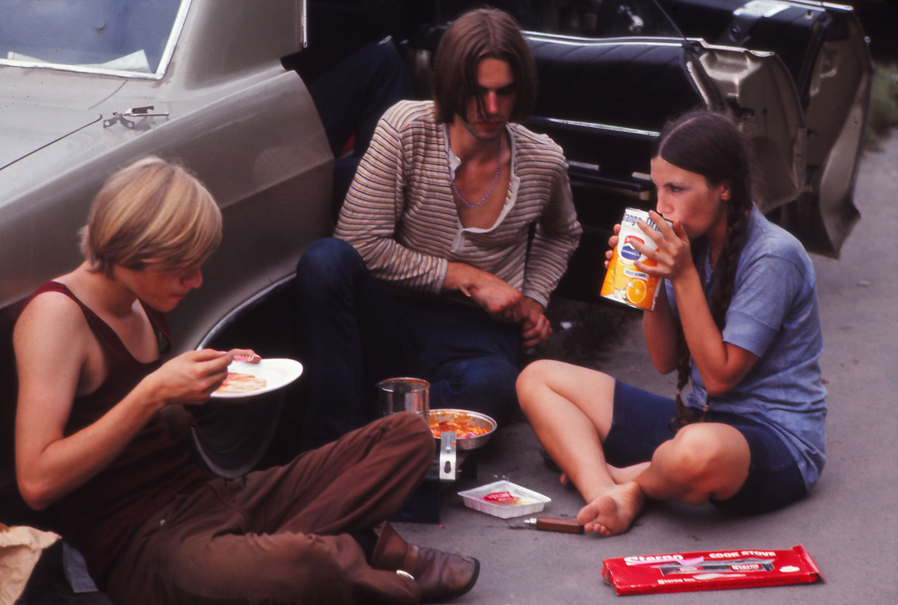Young people relaxing and eating on their way to the Woodstock Music Festival, New York, US, August 1969. Young people relaxing and eating on their way to the Woodstock Music Festival, New York, US, August 1969.